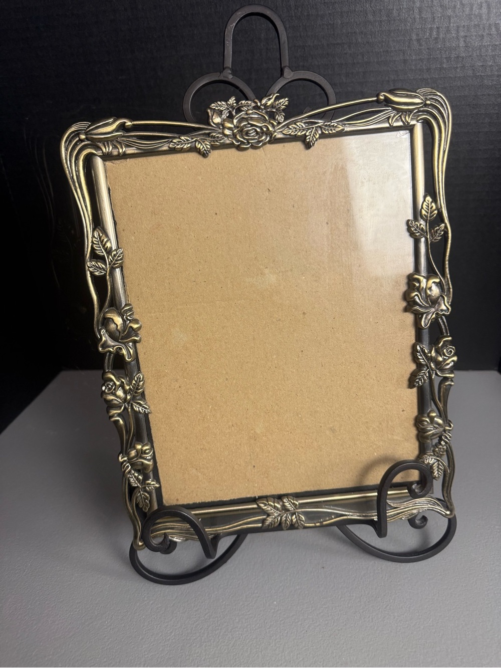 Ornate picture frame with stand.